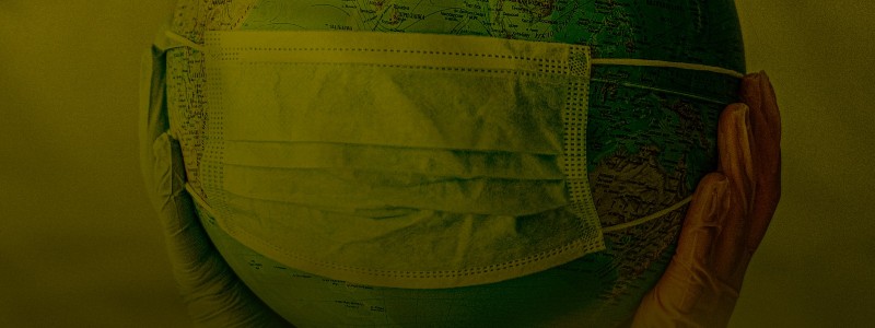 covid-19 mask on a globe