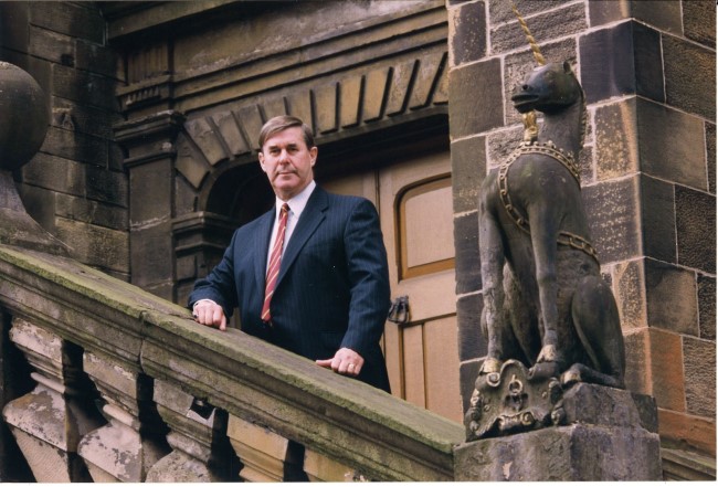 An image of Professor Sir Graeme Davies on the Lion and the Unicorn Staircase at UofG