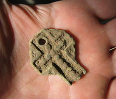 Pewter crucifix recovered during the archaeological survey of the Battle of Culloden