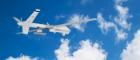 A white military drone flying against a blue sky with white clouds. Source: Sommersby | iStockPhoto https://www.istockphoto.com/photo/military-rc-drone-flies-against-the-backdrop-of-blue-peaceful-sky-with-white-clouds-gm1358942817-432422555