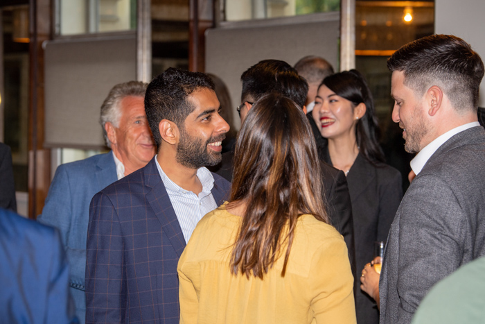 Guests talking at the 2022 MBA reunion dinner