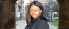 Dr Josephine Adekola outside University of Glasgow cloisters