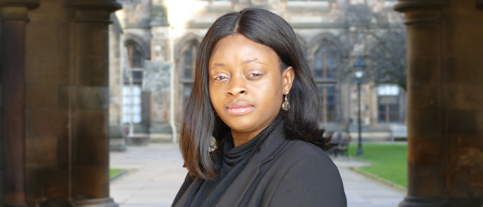 Dr Josephine Adekola outside University of Glasgow cloisters