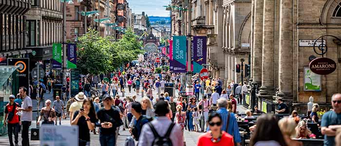 Crowds of people in Buchanan Street in Glasgow on a sunny day Source: vv shots Publisher: Istockphoto Link: https://www.istockphoto.com/photo/people-with-face-masks-on-regent-street-london-gm1290281515-385711257?clarity=false
