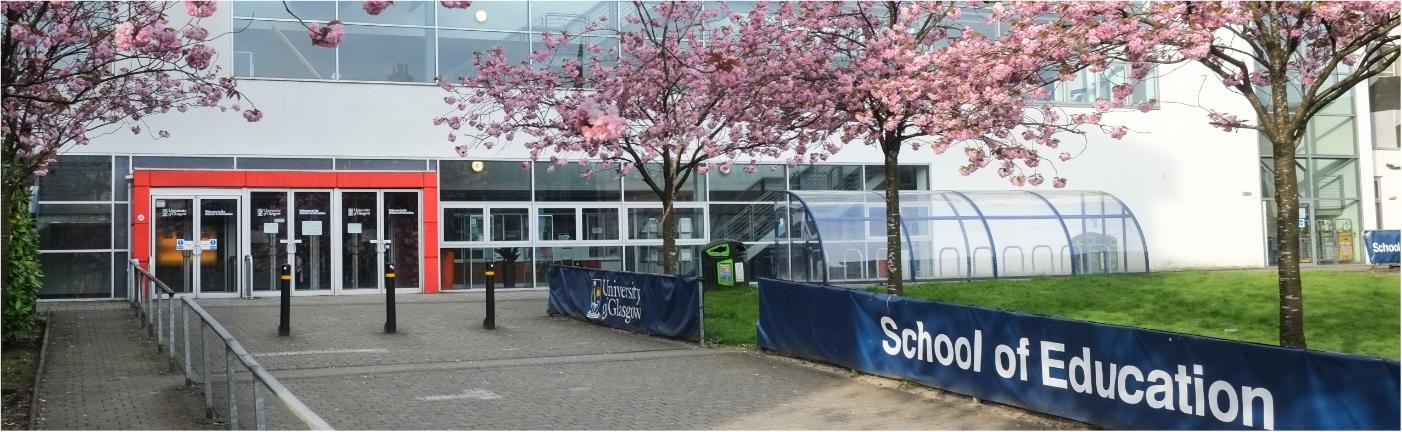 St. Andrew's Building with cherry blossom trees in the foreground.