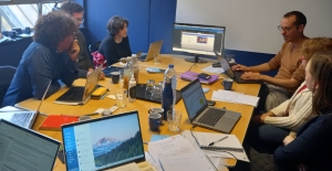 EPD team around a desk having a meeting