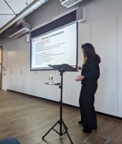 Image of a person giving presentation