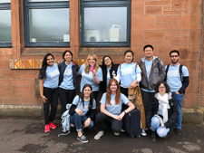 Photograph of the whole Kinning Park Complex GSF in Action team in front of the building. 