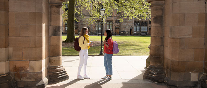 Students chatted underneath archway