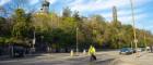 A cyclist on a quiet road in Edinburgh on a sunny day with some old monuments on the hill behind him. Source: DavidGraham86 | iStockphoto https://www.istockphoto.com/photo/bike-rider-on-princes-street-a1-gm525233998-92374469