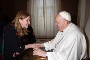 Professor Roisin Coll shakes Pope Francis' hand.