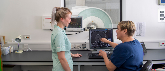 Two veterinary nurses discussing an MRI scan at the Small Animal Hospital