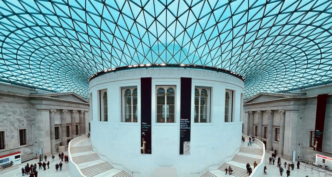 Interior of the lobby of The British Museum shows an intricate glass roof [photo: Rabih Ramadan, Unsplash]