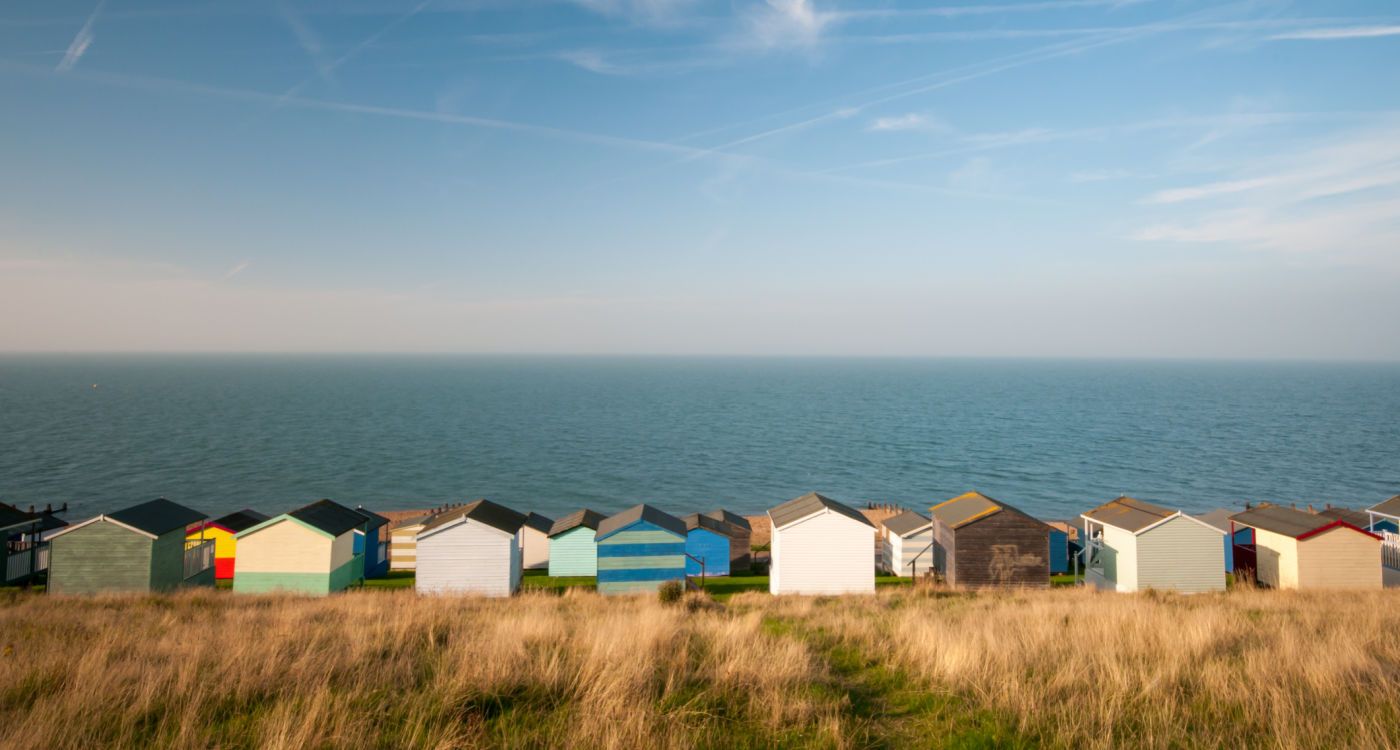 Row of beach huts overlooking the sea at Whitstable, Kent [photo: Shutterstock]