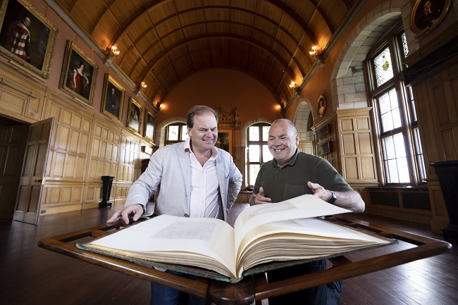 Lord Dalmeny and Professor Gerard Carruthers of the University of Glasgow at Barnbougle Castle looking through the Burnsiana book, now on loan to the University
