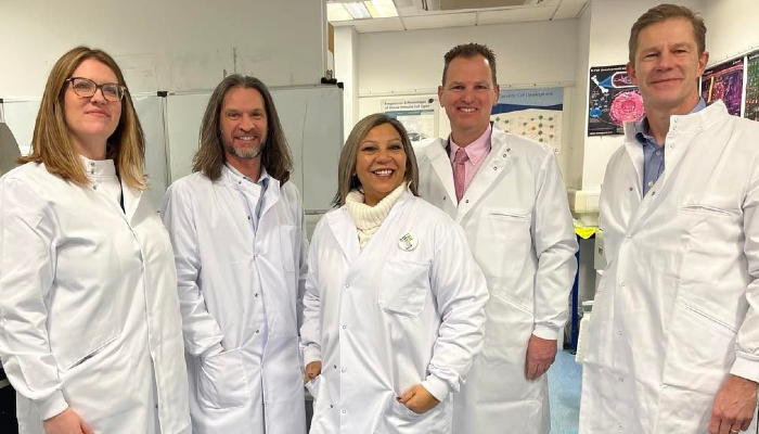 An image showing, from left to right, Lauren Bennie of Versus Arthritis Scotland, Carl Goodyear, Kaukab Stewart, Iain McInnes, Stefan Siebert in lab coats