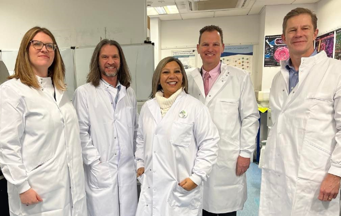 An image showing, from left to right, Lauren Bennie of Versus Arthritis Scotland, Carl Goodyear, Kaukab Stewart, Iain McInnes, Stefan Siebert in lab coats