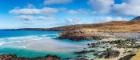 Photo of a Scottish beach with blue sky above