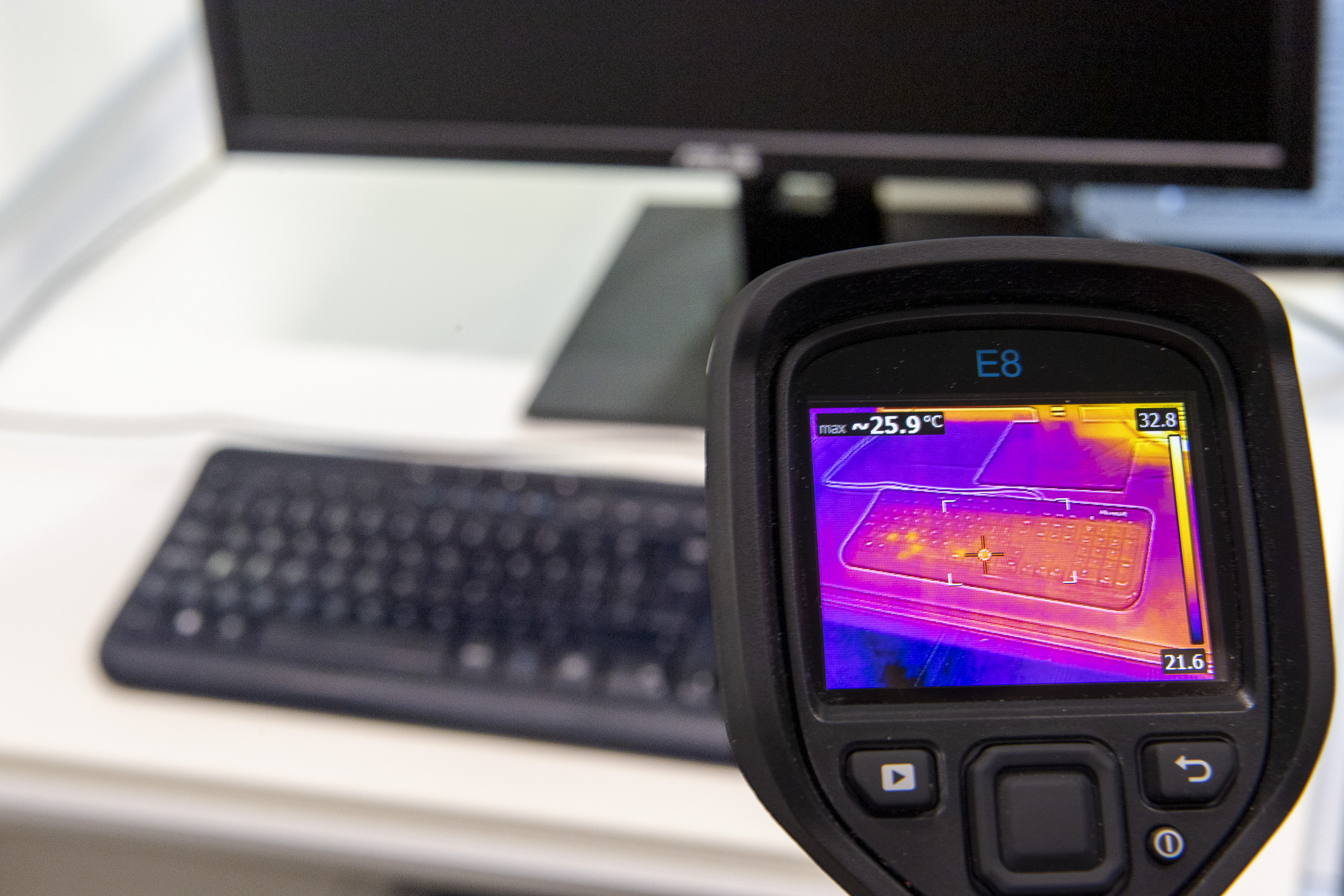 A FLIR thermal camera pointed at a keyboard showing heat traces. The heat traces show which keys were pressed and in which order. 