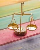 A small scales on a colourful table