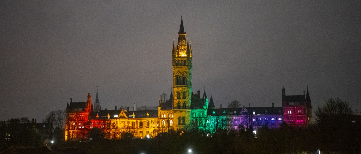 Photo of University of Glasgow lit up in rainbow colours
