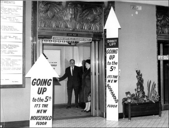 Photograph of customers using the lift, c1970.  (GUAS Ref: HF 51/6/1/5/5 photo 1. Copyright reserved.)