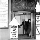 Photograph of customers using the lift, c1970.  (GUAS Ref: HF 51/6/1/5/5 photo 1. Copyright reserved.)