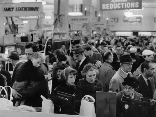 Photograph of customers browsing the sale items during the winter sale, c1960.  (GUAS Ref: HF 51/6/1/5/3 photo 1. Copyright reserved.)