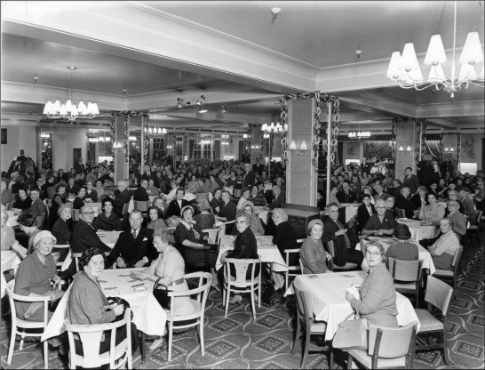 Photograph of customers sitting at tables in the restaurant involved in the Whist Drive, c1958.  (GUAS Ref: HF 51/6/1/6/2. Copyright reserved.)