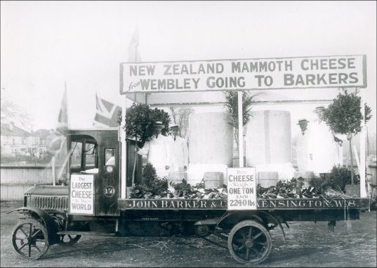 Mammoth New Zealand Cheese.  Purchased by John Barkers from the Wembley exhibition: Cheeses loaded ready for transportation to the store in Kensington, 1924.  (GUAS Ref: HF 51/8/1/1/3 photo 13. Copyright reserved.)