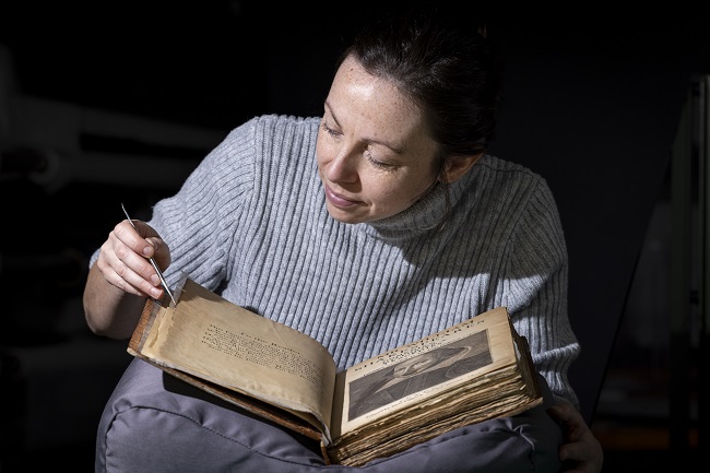Keira McKee, a Book Conservator at University of Glasgow, working on the University of Glasgow’s First Folio copy. The University’s First Folio is held in the Library’s Archives & Special Collections. Credit Martin Shields