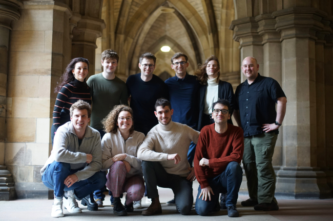 A picture of the GRILL team gathered in the University cloisters