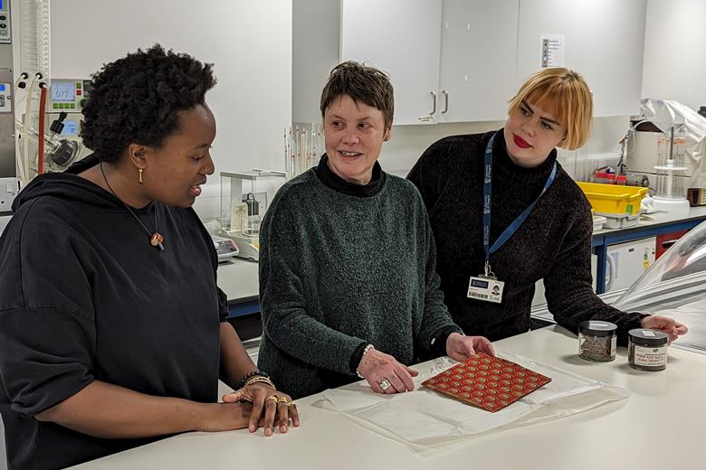 Researchers from the Kelvin Centre in the lab examining historical dyes in a textile sample