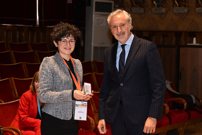 Dr Ornela Dardha with ambassador Angeloni receiving the medal for ‘Science, She Says!’ Award