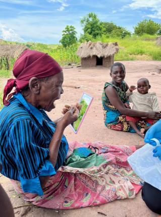 Malawian woman testing for a respiratory virus. 