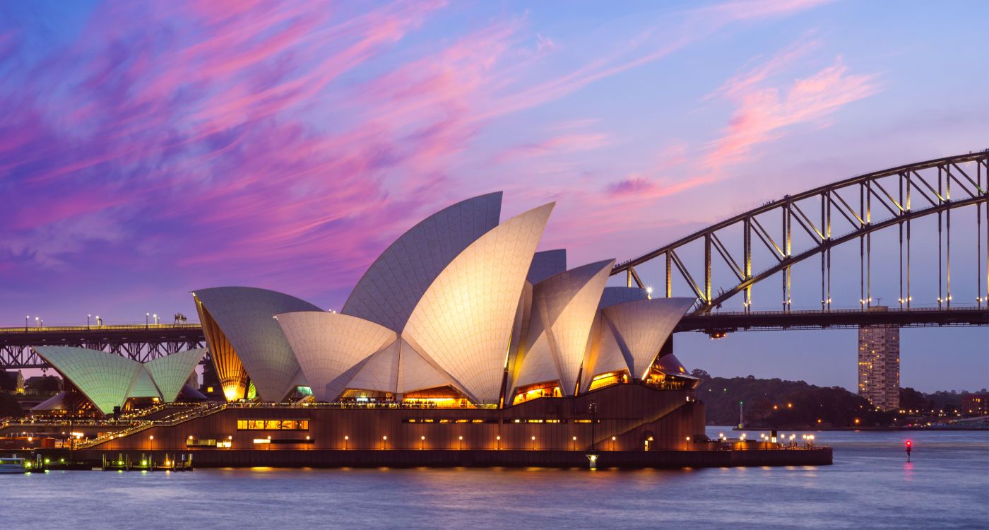 Sydney Opera House with a pink sky and Sydney Harbour Bridge in the background [photo: Shutterstock]