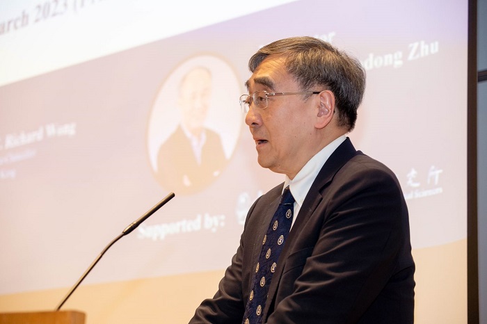 Speaker at a podium: Source: Hong Kong University