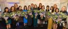 Images of shortlisted candidates at the House of Commons holding flowers in a group