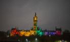 The Gilbert Scott Tower lit up in rainbow colours