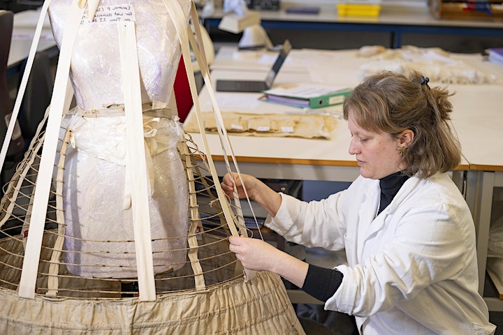 Postgraduate from the Kelvin Centre at work on conservation treatment of a dress 
