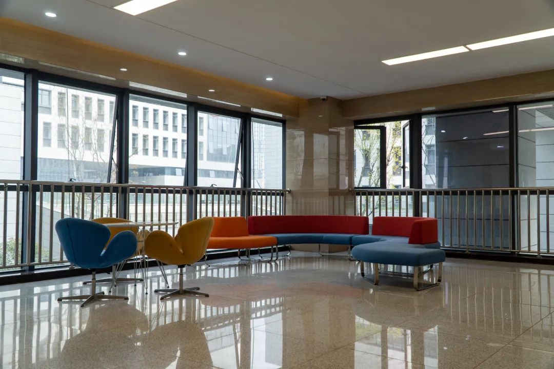 Sofas and big windows let in light to student meeting space