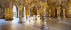 UofG letters lit up in the undercroft