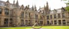 Alma Mater sculpture in the quadrangle looking at main building roof