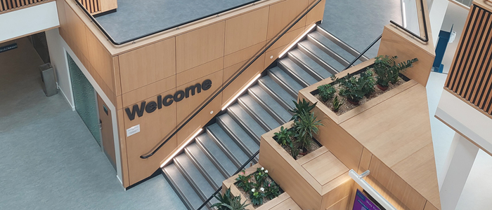 Photo of Clarice Pears building level 1 with welcome sign and plants