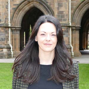 Dr Federica Farolfi, Lecturer in Behavioural Economics, profile photo in the West Quadrangle at the University of Glasgow