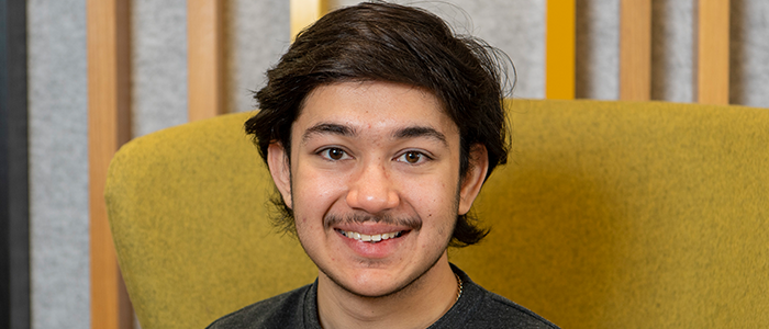 Image of Ashit sitting on a chair