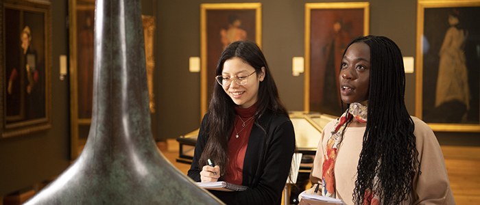 Two students discussing an exhibition at the Hunterian Gallery