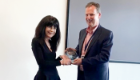 Professor Maggie Harnett receives her Tenovus medal from Professor Ian McInnes