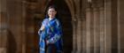 Dr Diana Gabaldon wearing the University of Glasgow tartan in the Cloisters at the University of Glasgow ahead of her lecture in the Bute Hall. Credit Martin Shields