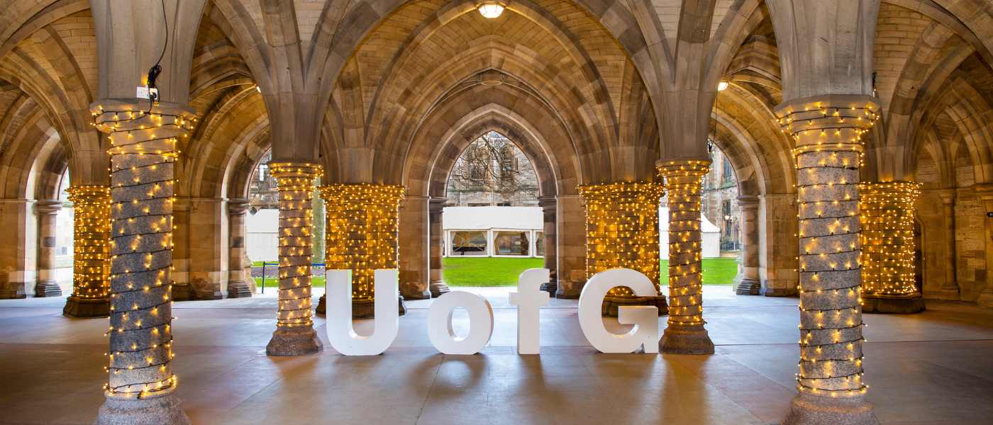 Letters spelling out UofG within Cloisters